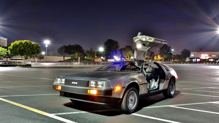 DeLorean car in mall parking lot.