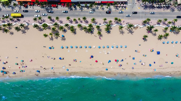 aerial photography of coastline with people