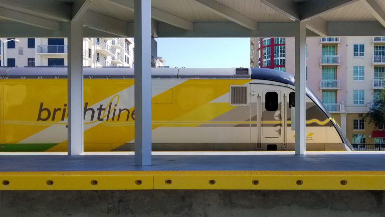 Brightline train standing at the West Palm Beach station.