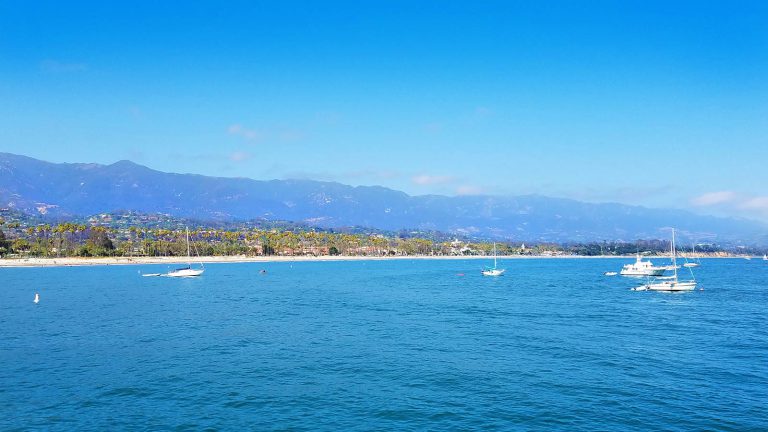 Blue waters against a blue sky with the coastline in Santa Barbara, California