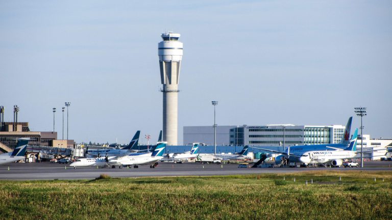 white passenger plane on airport during daytime