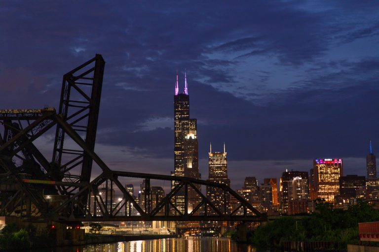 Chicago skyline against an purple evening sky.