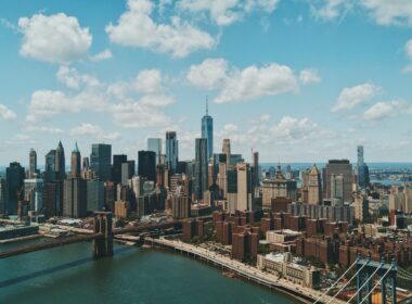 wide angle photo of Brooklyn Bridge under cloudy sky