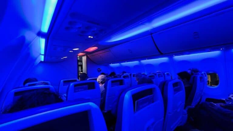 Interior of a Southwest plane with strong blue lighting.