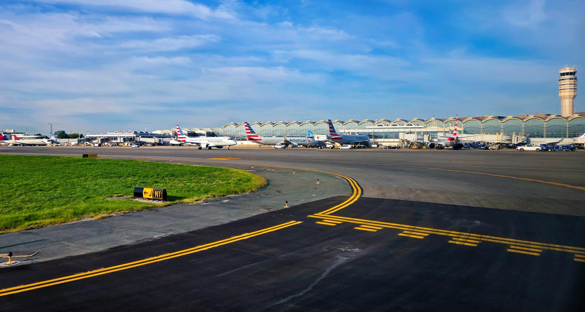 Different planes standing at different gates at the Washington National airport.